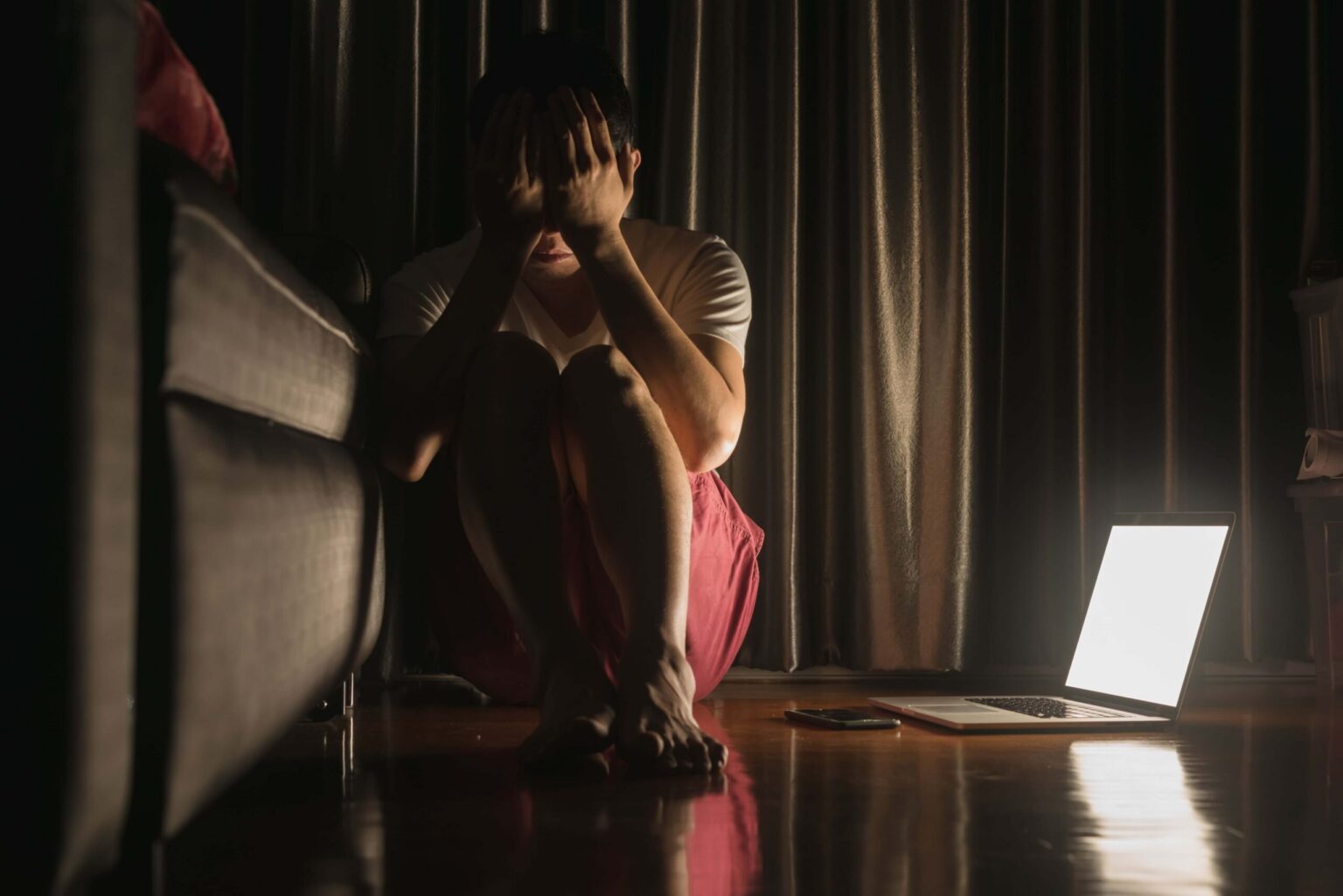 depressed man checking social media