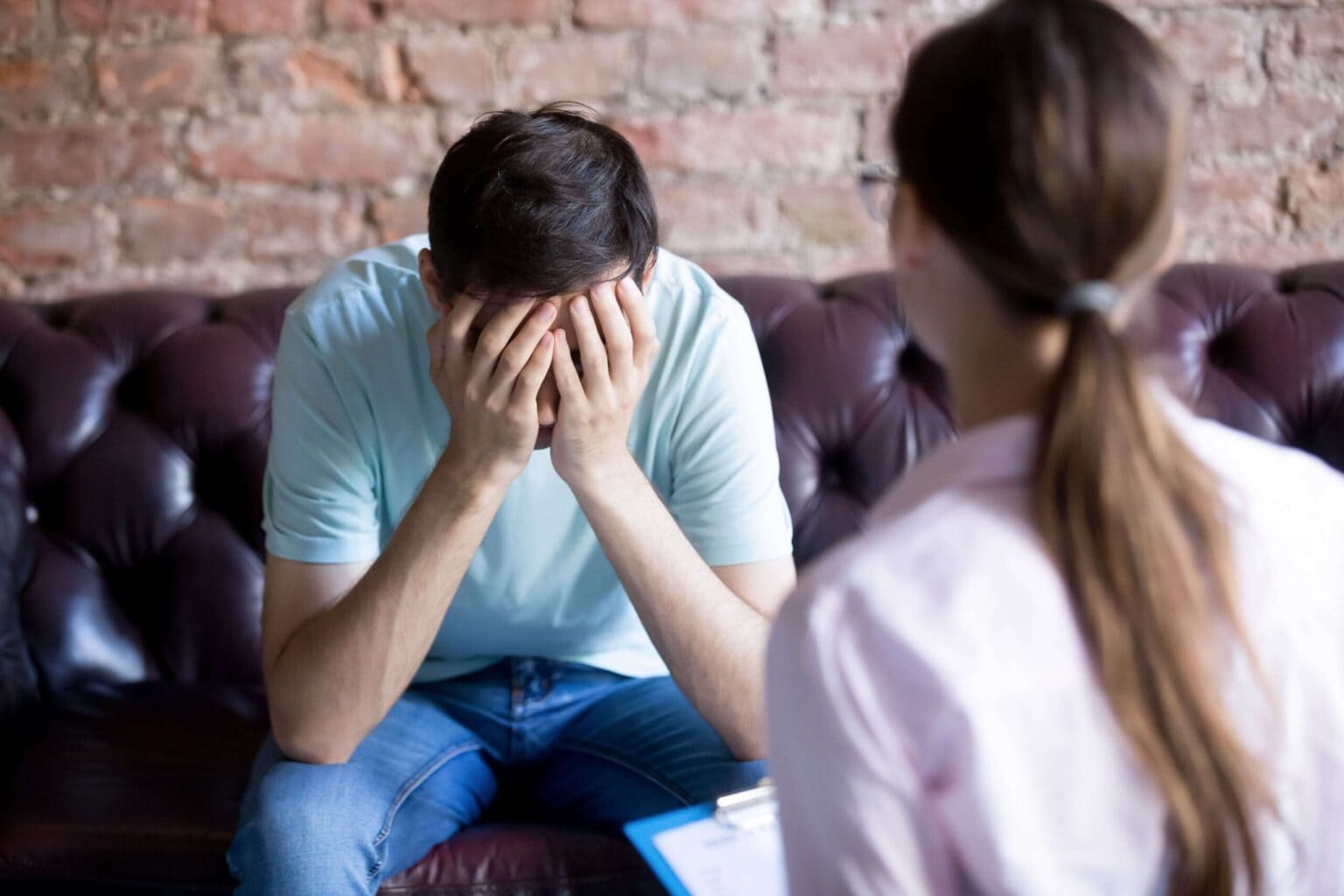 man dealing with trauma during somatic experiencing therapy
